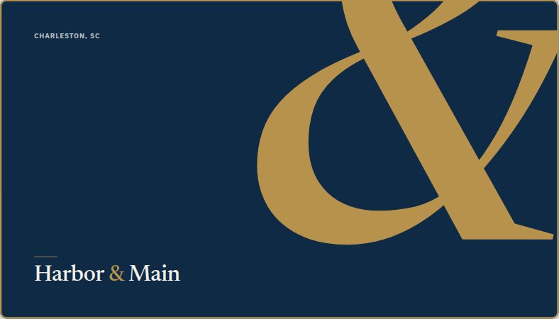 Harbor & Main founder's card: a navy card with a large brass ampersand.